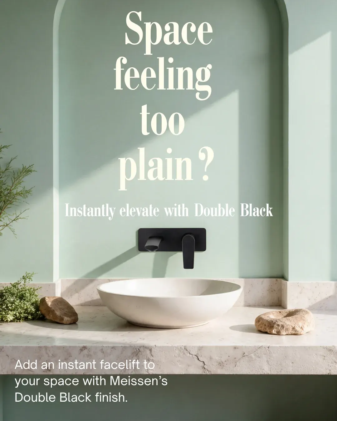 Sage green bathroom niche with a matte black wall-mounted tap and pale stone vessel basin