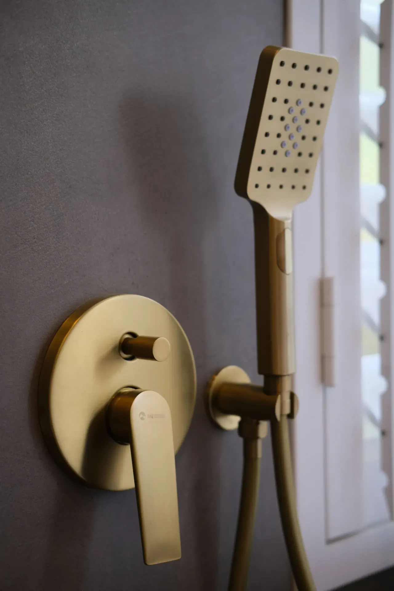 Brushed brass concealed shower mixer and handheld shower